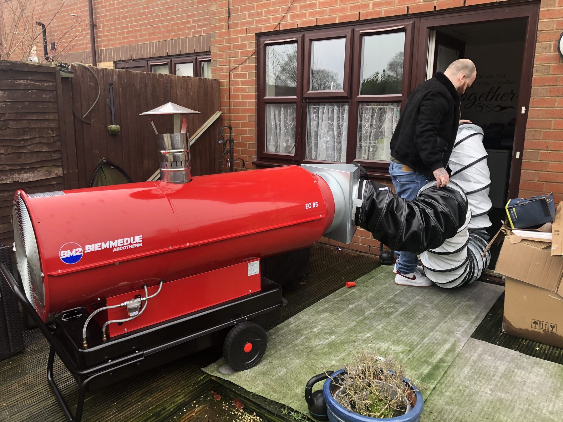 Bed bug heat treatment specialist operating an industrial heat machine